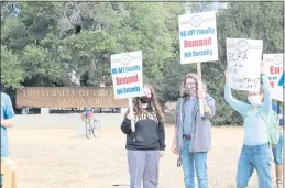  ?? RYAN STUART — SANTA CRUZ SENTINEL ?? Megan Thomas (right), Donovan McFann (middle) and Libby Oren (left) picketed at the entrance to UC Santa Cruz’s campus on Tuesday in solidarity with lecturers asking for more job security.