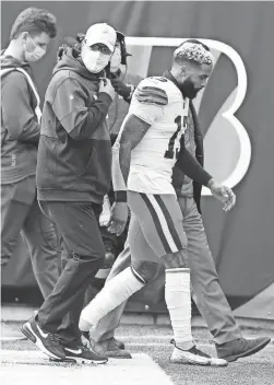  ?? JOSEPH MAIORANA/USA TODAY SPORTS ?? Browns wide receiver Odell Beckham Jr. leaves the field after suffering a torn ACL on Sunday against the Bengals.