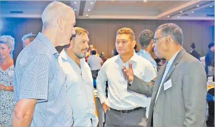  ?? Picture: ATU RASEA ?? Deputy Prime Minister and Minister of Finance Biman Prasad (right) speaks with members of the Fiji-Australia Business Council meeting at GPH in Suva yesterday.