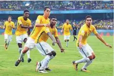  ?? AFP ?? Lincoln (centre) of Brazil celebrates after scoring a goal against Spain in the U-17 World Cup in Kochi earlier this month. Brazil play Germany in the quarter-finals today.