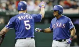  ?? TONY DEJAK — THE ASSOCIATED PRESS ?? Texas Rangers’ Adrian Beltre, right, is congratula­ted by Mike Napoli after Beltre hit a solo home run off Cleveland relief pitcher Cody Allen in the ninth inning Tuesday in Cleveland. The Rangers won, 2-1.
Tuesday’s Phillies game at Seattle was not...