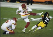  ?? JUSTIN K. ALLER – GETTY IMAGES ?? Dustin Hopkins of the Washington Football Team kicks the go-ahead field goal in the fourth quarter against Pittsburgh.