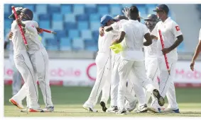 ??  ?? Sri Lanka players celebrate after they beat Pakistan in Second Test cricket match against Pakistan in Dubai Tuesday. (AP)