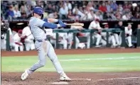  ?? PHOTO: JOE CAMPOREALE-USA TODAY ?? Nico Hoerner of the Chicago Cubs hits an RBI single against the Arizona Diamondbac­ks in their MLB game in Phoenix, Arizona, on Monday.