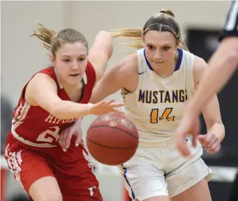  ??  ?? EYES ON THE BALL: Norwood’ Megan Olbrys and Hingham’s Caroline Connelly race for a loose ball.