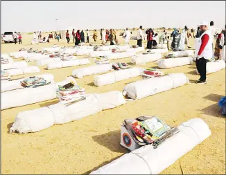  ?? KUNA photo ?? Kuwait Red Crescent Society sets up tent camps to house flood victims in Sudan.