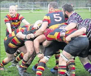  ??  ?? Ben Gray directs an Ashford attack against Anchorians. Below, Adam Knight and Will Welsh smother an Anchs attack