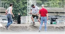  ?? JOHN MAHONEY ?? Workers prepare the site for this weekend’s urban rodeo in the Old Port. Organizers of Montreal’s 375th anniversar­y celebratio­ns said they wanted to infuse “a bit of country” into the celebratio­n.