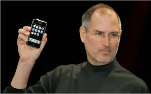  ?? — AFP ?? Steve Jobs unveiling iPhone at the Macworld Conference on January 9, 2007, in San Francisco.