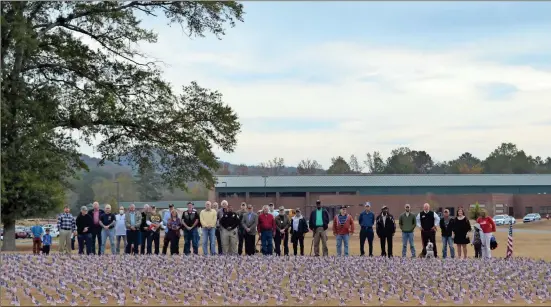  ??  ?? Veterans gathered outside of Van Wert Elementaty following a Friday ceremony at the school held in their honor as part of a new program to help youth understand the meaning of the holiday.