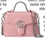  ??  ?? GG Marmont mini top handle bag in pink