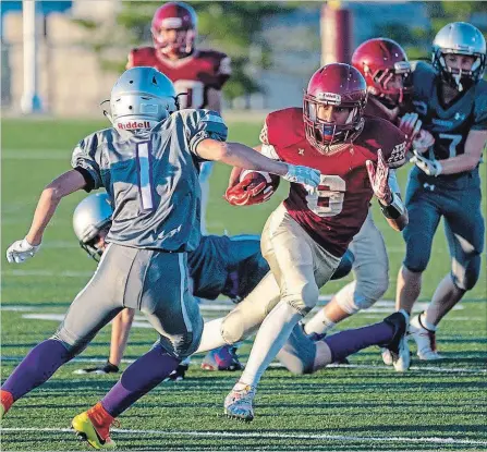  ?? SCOTTY WOODLAND SPECIAL TO THE ST. CATHARINES STANDARD ?? Niagara Spears back Adrian D'Gyves, with the ball, in action against the London Jr. Mustangs in Ontario Provincial Football League bantam playoff action at Kiwanis Field in St. Catharines.