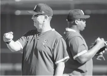  ?? HAYNE PALMOUR IV U-T ?? This is second season with Padres for bench coach Bobby Dickerson (left) and first base coach Wayne Kirby.