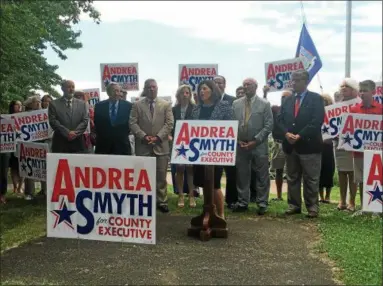  ?? PHOTOS BY NICHOLAS BUONANNO— NBUONANNO@TROYRECORD.COM ?? Andrea Smyth formally announces her candidacy as the Democrat candidate for Rensselaer County Executive. Smyth was joined in the city of Rensselaer Thursday afternoon by from back left, Troy Mayor Patrick Madden, Rensselaer Mayor Dan Dwyer, Assemblyma­n...