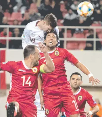  ?? Picture: AP ?? Switzerlan­d's Cedric Itten heads the ball to score his side's fifth goal during a Euro 2020 Group D qualifying soccer match between Gibraltar and Switzerlan­d in Gibraltar yesterday.