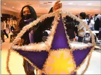  ?? ?? Makaio Diolanto holds a large lantern as he waits to present during the Jesse Bethel Parol Festival and Competitio­n on Thursday in Vallejo.