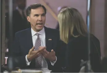  ?? CP PHOTO ?? Minister of Finance Bill Morneau takes part in a televised interview after delivering the federal budget in the House of Commons on Parliament Hill Wednesday.