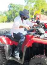  ?? ?? Joan McDonald, Miss Jamaica World 1978 weighs her options, taking the time to feel out this offroad vehicle.