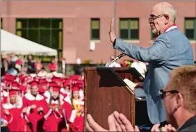  ?? SEAN D. ELLIOT/THE DAY ?? Author Wally Lamb waves to the graduates after offering his remarks to the Norwich Free Academy Class of 2018 during commenceme­nt exercises on Thursday in Norwich.