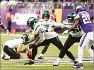  ?? Bruce Kluckhohn / Associated Press ?? Jets kicker Greg Zuerlein kicks a 60-yard field goal during the first half against the Vikings on Sunday in Minneapoli­s.