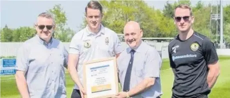  ?? Pete Barton ?? Pictured ( from left) to mark Widnes FC’s promotion to the Evo-Stik League North are chairman Ian Ross, co-player/manager Steve Akrigg, Hallmark Security League committee member Ian Williams and club captain Kev Pollard.