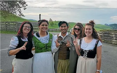  ??  ?? River Price, second from left, had worked at Hobbiton Movie Set as a tour guide for four years.