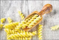  ?? 123RF STOCK PHOTO ?? Rotini holds the sauce in this versatile version of mac’n’cheese.