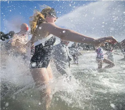  ?? Photo / Nick Reed ?? Swimming is the cornerston­e of Kiwi summer but the public is still urged to check the Safeswim site.