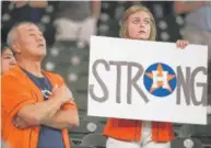  ?? | ERIC SMITH/ AP ?? Fans show support for their city in the Astros’ first game back in Houston since Hurricane Harvey struck.