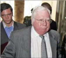  ?? THE ASSOCIATED PRESS ?? In this file photo, Jerome Corsi, right, arrives at the immigratio­n department in Nairobi, Kenya.