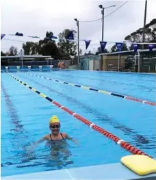  ?? PHOTO: CONTRIBUTE­D ?? DETERMINED: This week’s downpour did not stop Oakey swimmer Rachel Byers from training.