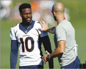  ??  ?? In this Aug. 6 file photo, Denver Broncos wide receiver Emmanuel Sanders, (10) confers with wide receiver coach Zach Azzanni during an NFL football training camp session in Englewood, Colo. AP PHOTO/DAVID ZALUBOWSKI