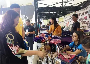  ?? -Princess Clea Arcellaz ?? SOCSECON 2019. CLTV36 President and General Manager Sonia P. Soto checks on the different products sold during the SocSeCon 2019 held at Robinsons Starmills in the City of San Fernando.