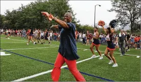  ?? ANTONIO PEREZ / CHICAGO TRIBUNE ?? Joyce Kenner, principal Whitney Young Magnet High School, celebrates the 2019 opening of a new athetlic complex named after the school’s most famous alum, Michelle Obama.