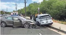  ?? LAGUNA BEACH POLICE DEPARTMENT ?? A Tesla that the driver said was in Autopilot mode struck a parked police vehicle in Laguna Beach, Calif., on Tuesday.