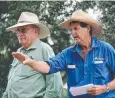  ??  ?? HAPPY DAYS: Auctioneer Jacko Shephard (right).