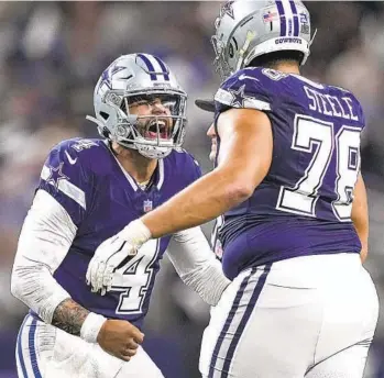  ?? SAM HODDE AP ?? Cowboys quarterbac­k Dak Prescott celebrates with tackle Terence Steele after throwing touchdown pass.