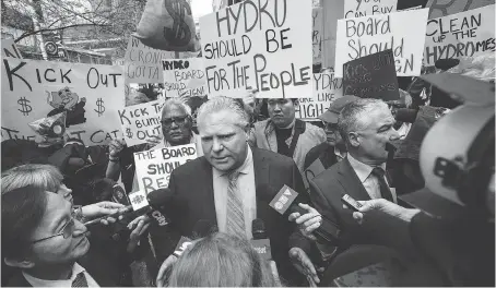  ?? AARON VINCENT ELKAIM/THE CANADIAN PRESS ?? Ontario PC Leader Doug Ford joined protesters Tuesday outside Hydro One’s AGM in Toronto.