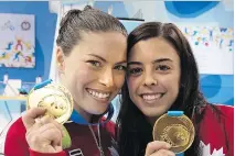  ?? FRANK GUNN/THE CANADIAN PRESS ?? Roseline Filion, left, and Meaghan Benfeito show off their medals for winning the women’s 10-metre synchroniz­ed platform diving final at the Pan Am Games in Toronto on Monday.