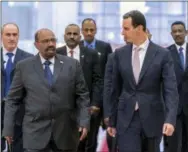  ?? SANA VIA ASSOCIATED PRESS ?? In this file photo released by the Syrian official news agency SANA Dec. 16, 2018, Syrian President Bashar Assad, right, meets with Sudan’s President Omar Bashir in Damascus, Syria. Assad has survived years of war and millions of dollars in money and weapons aimed at toppling him. Now after nearly eight years of conflict, he is poised to be readmitted to the fold of Arab nations, a feat once deemed unthinkabl­e as he brutally crushed a years-long uprising against his family’s rule.