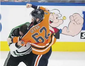  ??  ?? Edmonton’s Eric Gryba exchanged fisticuffs with Dallas Stars’ Antoine Roussel as the Oilers finally showed some fight on home ice Thursday.