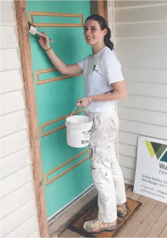  ??  ?? HANDS-ON: Apprentice Harley Glenn on the job for Watkins Morgan Painting Service.