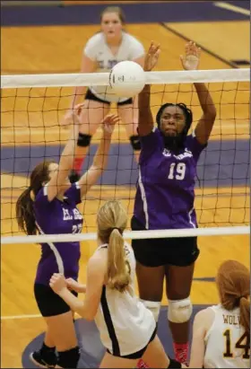  ?? Terrance Armstard/News-Times ?? Blocked shot: El Dorado's Kamya Bryant (19) and Errin Rogers go up for a block against Lake Hamilton. The Lady Wildcats host Ruston today at 4:30 p.m. in volleyball action at Wildcat Arena.