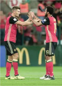  ?? — Reuters ?? Belgium’s Thomas Meunier celebrates scoring their seventh goal with Mousa Dembele.