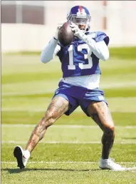  ?? Adam Hunger / Associated Press ?? Giants receiver Odell Beckham makes a catch during the team’s practice Tuesday in East Rutherford, N.J.