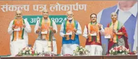  ?? HT ?? The BJP released its manifesto for Lok Sabha elections in the presence of Union home minister Amit Shah, defence minister Rajnath Singh, PM Narendra Modi, BJP president JP Nadda, finance minister Nirmala Sitharaman in New Delhi on Sunday.