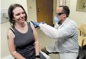  ?? TED S. WARREN/AP ?? Jennifer Haller smiles after she was given a potential vaccine for COVID-19 on Monday in Seattle.