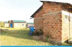  ?? —Reuters ?? KISUMU: Esther Akinyi cleans outside her home on the Kibos Kisumu housing estate, Kisumu, Kenya.