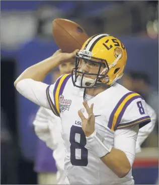  ??  ?? LSU quarterbac­k Zach Metten
berger threw for 2,600 yards last season, and coach Les Miles says he expects him to be much
better this year. With new offensive coordina
tor Cam Cameron, the Tigers will feature an offense that Miles believes
will be...