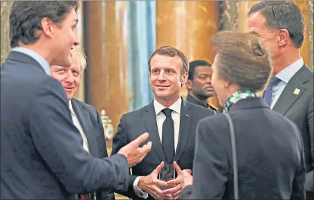  ??  ?? Justin Trudeau, left, with Boris Johnson, Emmanuel Macro, Jens Stoltenber­g, and Princess Anne, caught poking fun at US President Donald Trump at Buckingham Palace